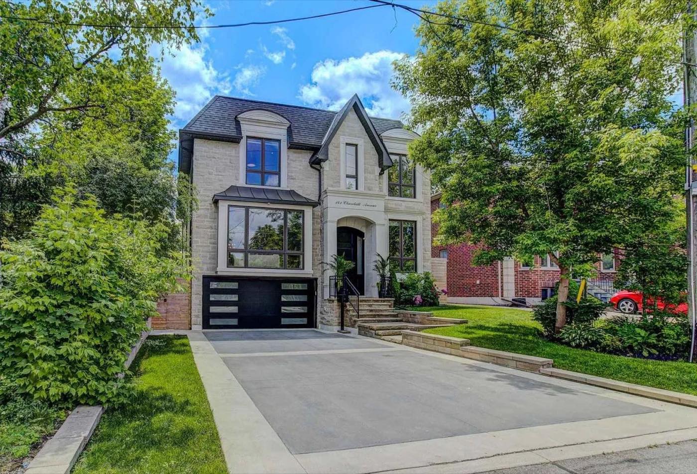 Exterior renovation of a detached home with a new deck